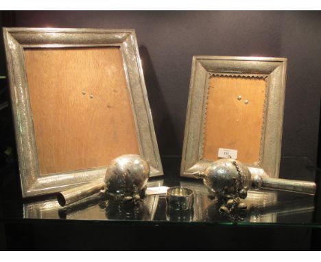 Two Iranian silver easel photograph frames, chased and engraved with Persian motifs, 31 x 26cm (12.2 x 10.3in) and 24 x 18.5c