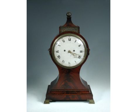 A Regency mahogany balloon case bracket clock, the white dial with Roman numerals surmounted by a ball topped pediment, side 