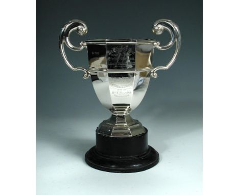 An Edwardian silver two handled trophy cup, London 1908, of octagonal pedestal form with moulded girdle, stylised acanthus ca