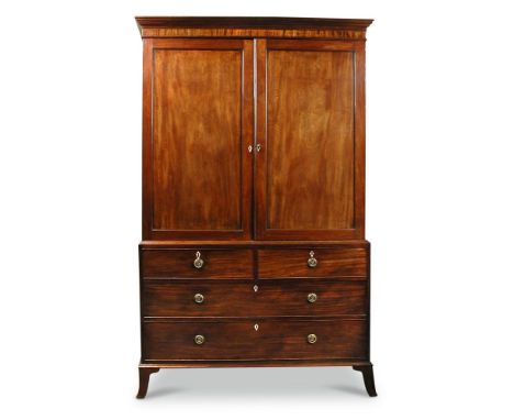 A late George III mahogany linen press, the lower part with two short and two long drawers, on swept bracket feet 210 x 133 x