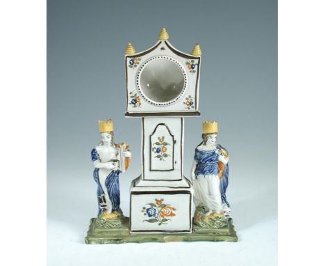 A Dixon Austin & Co pottery Pratt type watch stand, circa 1820, modelled as a longcase clock flanked by figures of Apollo and