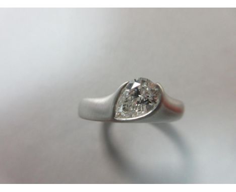 A contemporary single stone pear cut diamond ring, the pear-shaped adapted brilliant cut diamond, estimated weight approximat