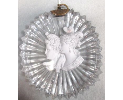 An 1830s sulphide plaque of Napoleon and Marie Louise, probably Baccarat, the star cut clear glass oval surmounted by a gilt 