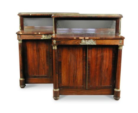 A pair of Regency rosewood Chiffoniers, with mirrored raised shelf backs and brass mounts, panel doors flanked by open column