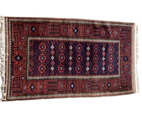 A Belouch rug, 216 x 110cm (84 x 43in)  Slightly faded, but even pile