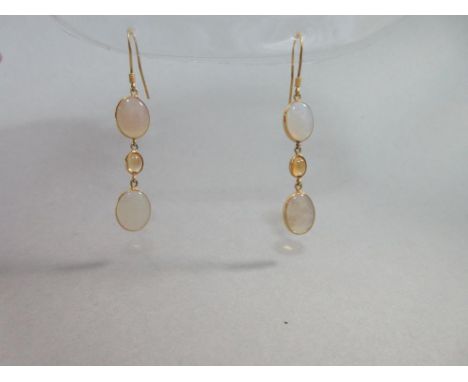 A pair of opal and citrine earpendants, each hook suspending a line of two oval cabochon jelly opals with a similar small cit