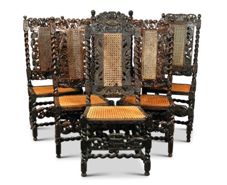 A Harlequin set of seven James II walnut high back dining chairs, each with a variation of design with cherub, shell and leaf