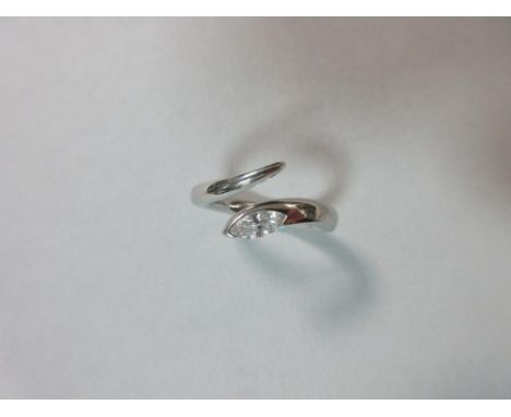 A modern single stone diamond snake ring, the marquise cut diamond, estimated weight 0.30cts, part collet set in the angled '