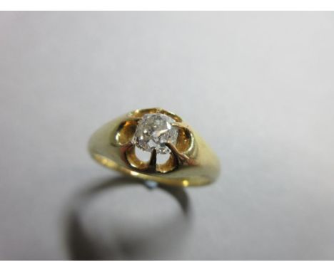 A Victorian single stone diamond ring, the old cushion cut diamond in a flying claw setting of yellow precious metal, inscrib