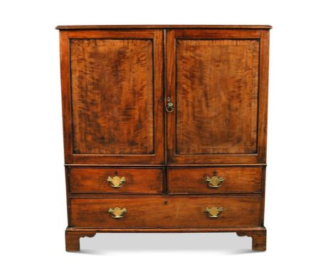 A George III mahogany dwarf press cupboard, having panelled doors above two short and one long drawer on bracket feet 197 x 1