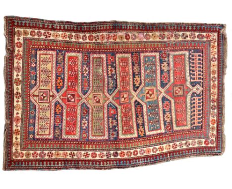 A late 19th / early 20th century Karabagh rug, 230 x 147cm (90 x 57in)  An old rug with wear and holed in places, reinforced 