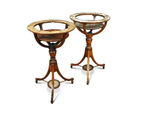 A pair of Regency mahogany Celestial and Terrestrial Globe stands, with the remains of horizon papers, on vase turned columns