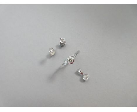 A matched suite of single stone diamond ring, earstuds and pendant set in white gold, each piece with a collet set round bril