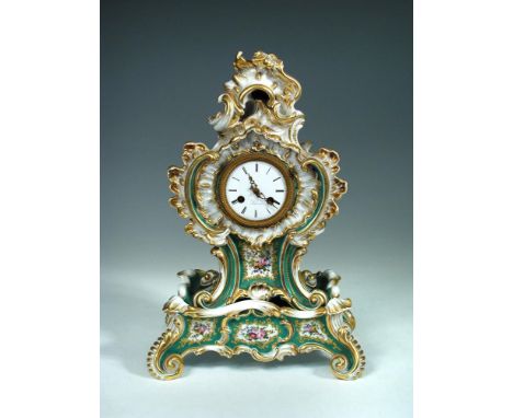 A 19th century porcelain mantle clock and stand by Jacob Petit, the enamel dial with Roman chapter ring, inscribed 'Scherer',