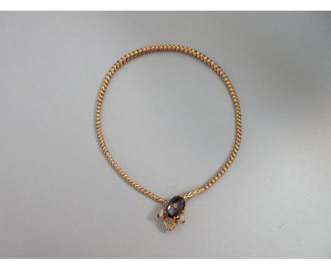 A Victorian gem set snake necklace, the body of graduated bulbous links of unmarked yellow precious metal, and the head cast,