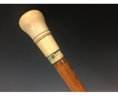 A late 19th century ivory topped horse measuring walking cane, the threaded ivory knop unscrewing to reveal the measuring sti