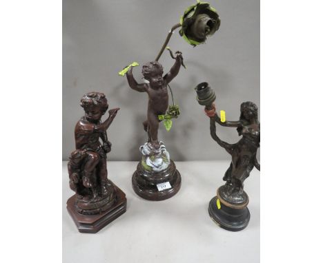 A cast metal cherubic lamp A/F together with a bronze effect lamp base  and a cast metal figural lamp (3)