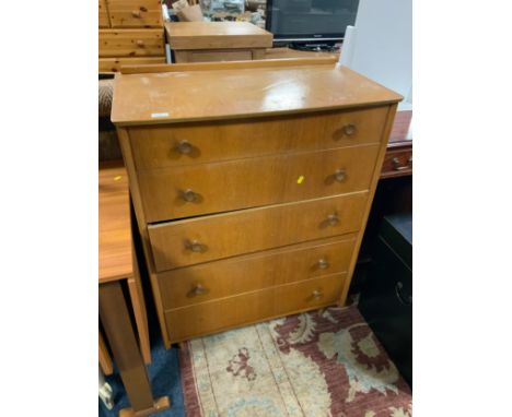 A vintage five drawer utility type chest of drawers