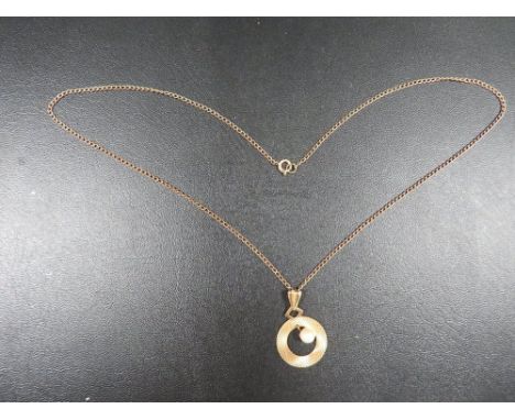 A hallmarked 9 carat gold pendant set with a seed pearl approx. weight 2.8g