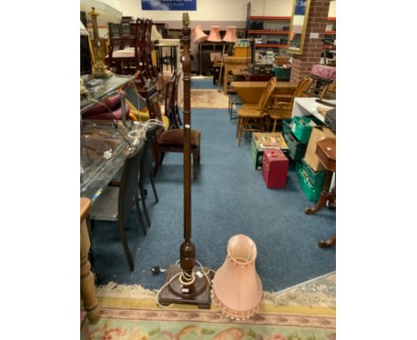 A vintage mahogany standard lamp and shade