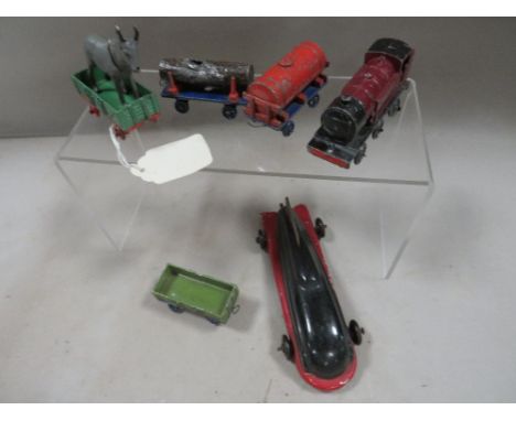 A vintage Meccano Dinky toys mini locomotive and carriages together with a tin plate car