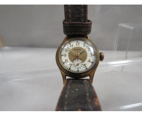 A vintage 'Aircraft' watch on a vintage leather strap with 'Rolex' logo