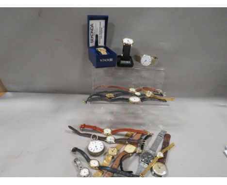 A tray of assorted vintage wrist and pocket watches
