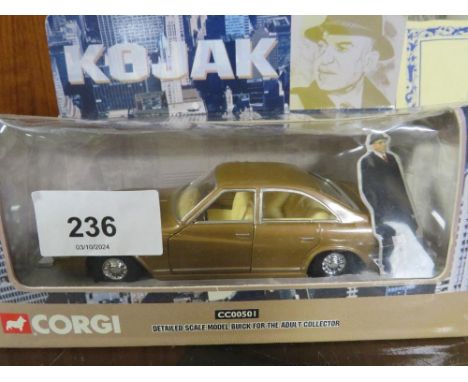 A Japanese tin plate friction drive model car in original box together with a boxed Corgi Kojak CC00501 scale model Buick car