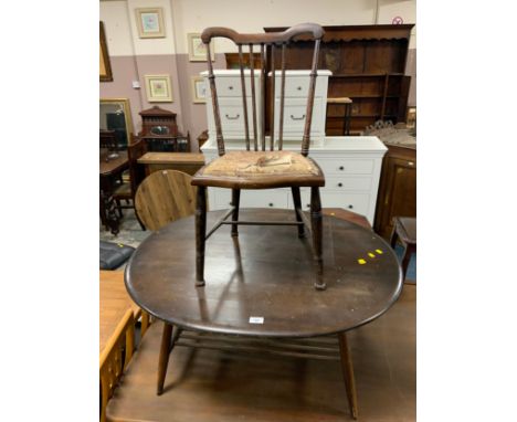 An Ercol oval coffee table (minus badge) together with a bedroom chair. (2)