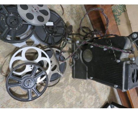 A vintage Specto film projector and reels of film