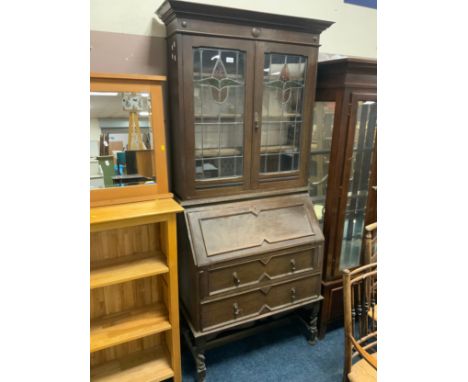 A vintage oak bureau bookcase