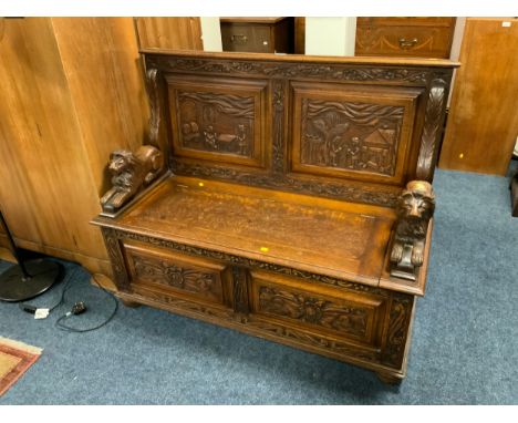 A heavy carved oak monks bench W 121 cm