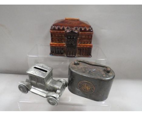A vintage Birmingham Municipal bank metal money box together with a treacle glaze Bank Of England money box together with ano