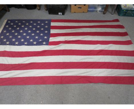 A large vintage U.S.A. stars &amp; stripes flag having 50 sewn stars, approx 8ft x 5ft