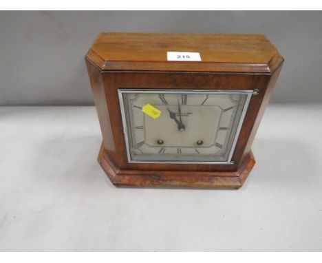 A walnut cased cased Garrard mantle clock