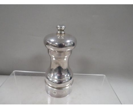 A hallmarked silver pepper grinder