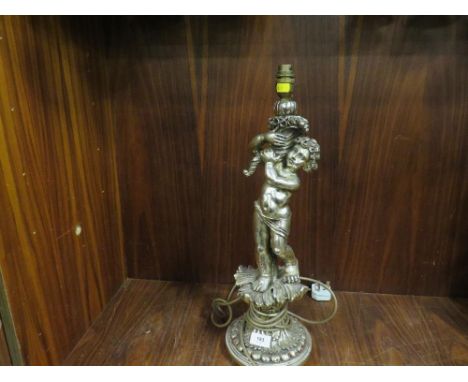 A silver gilt effect table cherub lamp