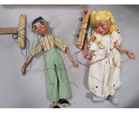 A vintage boxed Pelham puppet plus another