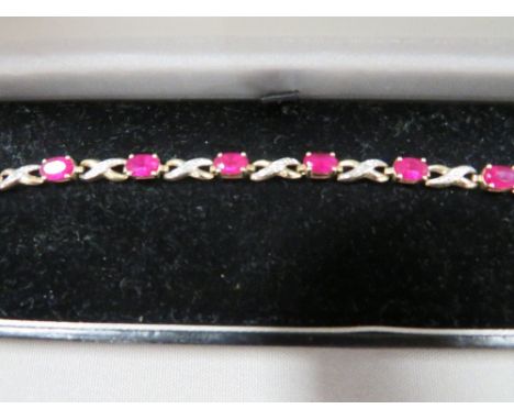 A hallmarked 9 carat gold ruby and diamond bracelet approx. weight 4.1g