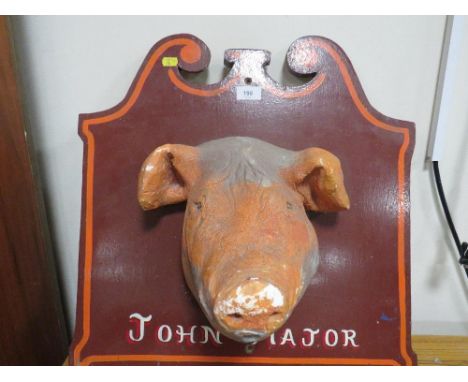A vintage plaster study of a pigs head on a wooden plaque titles 'John Major', inscribed verso 'Norma Major, 2 Much Wenlock, 