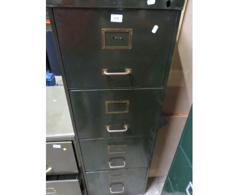 A vintage green 4 drawer filing cabinet