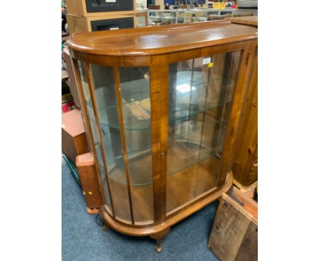 A vintage walnut china cabinet
