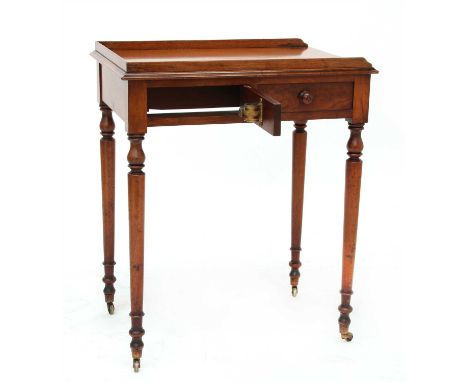 An unusual Victorian mahogany washstand, the three-quarter gallery over a frieze drawer and hinged mirror bracket to the rear