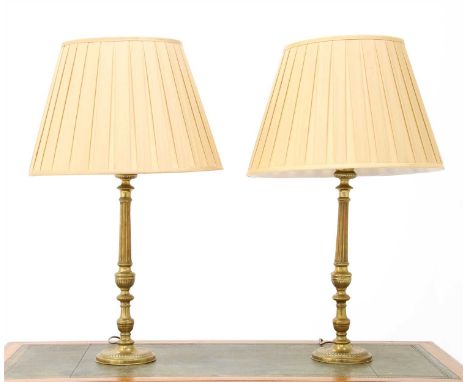 A pair of brass 'candlestick' table lamps, with silk shades, 83cm high overall (2)