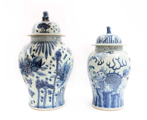 Two Chinese blue and white baluster vases and covers, 20th century, in the 18th century style, each with a Buddhist lion fini