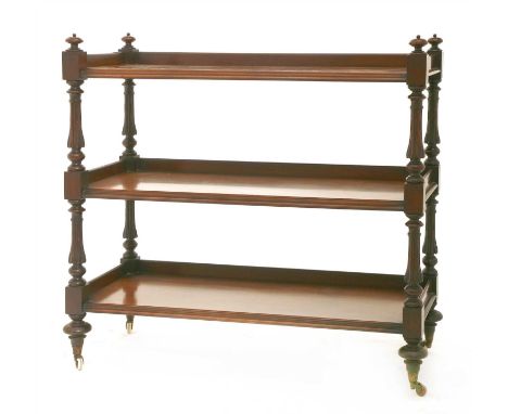 A Victorian mahogany three-tier buffet, raised on turned and moulded supports, 122cm wide 49.5cm deep 114cm high