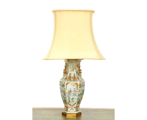 A Chinese famille verte vase table lamp, 19th century, the vase of hexagonal baluster shape with applied lions and serpents, 