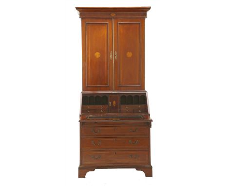 An Edwardian strung and inlaid mahogany bureau bookcase, the associated top with two panelled doors over a fitted bureau, fou