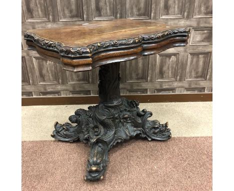 19TH CENTURY BLACK FOREST CARVED OAK CENTRE TABLE, the top of serpentine outline with flowerhead and acorn carved border, on 