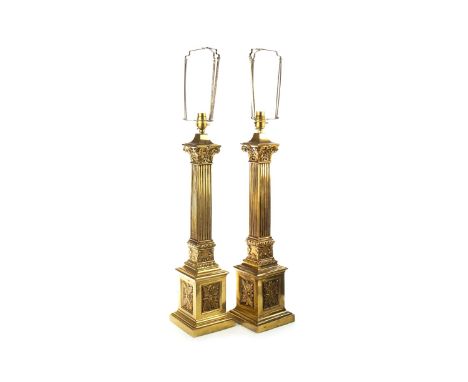 PAIR OF BRASS CORINTHIAN PILLAR TABLE LAMPS, formed by square columns, 78cm high, with green fabric shades; along with a gilt